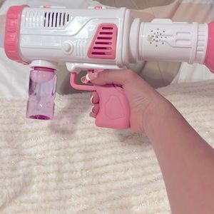 Blows bubbles (comes with bubbles )